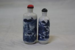 Two Chinese blue and white `landscape` snuff bottles, 1830-1900, each of cylindrical form painted