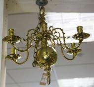 A Dutch style six branch ceiling light, with scrolling arms and wide drip pans, 18in. drop