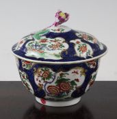 A Worcester blue scale ground sucrier and cover, c.1770, decorated with painted exotic flowers