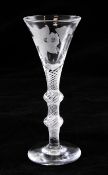 An airtwist double knop stem ale glass, c.1750, the funnel shaped bowl wheel engraved with a lily,