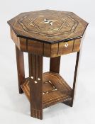 An Arts & Crafts octagonal walnut work table, with geometric ivory and specimen wood inlays, the