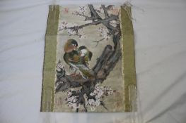 A 20th century Chinese scroll painting, of mandarin ducks perched on a prunus branch, red seal