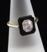 A 18ct gold, diamond and black onyx dress ring, with central oval cut diamond, size M.