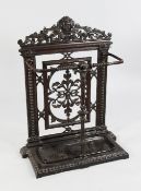 A Victorian cast iron stick stand, with bacchus mask crest and central scrolling acanthus leaf