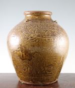 A Chinese Ming pottery jar, with four peony scrolls incised on the shoulder between horizontal ring