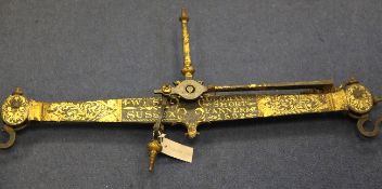 A 19th century black painted and gilt decorated 56lb beam scale, marked for De Grave, Short, Fanner