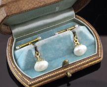 A pair of gold and natural pearl set cufflinks, of semi-baroque form, with GIA certificate dated 6/