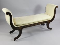 A Regency simulated rosewood scroll end window seat, with gilt line decoration and scroll legs