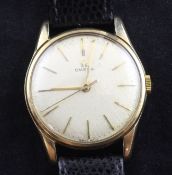 A gentleman`s 9ct gold Omega wrist watch, with baton numerals and centre seconds.