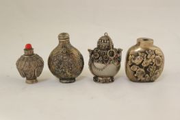 A Chinese silver snuff bottle and three white metal snuff bottles, late 19th / early 20th century,