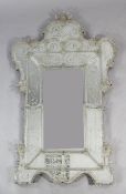 An Italian Venetian glass mounted mirror, Muranoin 18th century style, of cartouche form with an