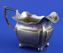 A George III Irish silver cream jug, with wriggle work engraving, William Doyle, Dublin, 1815, 4.5