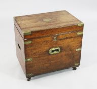 A late Victorian oak and brass bound cellaret, hinge lid opening to reveal a divided interior with