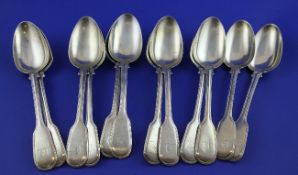 A set of twelve George IV silver fiddle and thread pattern table spoons, with engraved armorial,