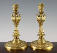 A pair of Louis XIV style ormolu candlesticks, with hexagonal sconces on circular base, 10.5in.