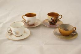 Four Royal Worcester bird and sheep painted cabinet coffee cups and saucers, the first painted with