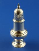 A late George II silver baluster caster or pepperette, with turned finial, John Delmester, London,