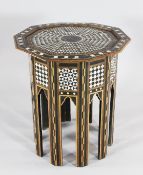 A 19th century Damascus mother of pearl and tortoiseshell inlaid decagonal table, on moorish arched
