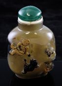 A large Chinese chalcedony cameo snuff bottle, 19th century, carved in high relief with three boys