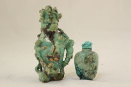 Two Chinese turquoise matrix snuff bottles and stoppers, 1860-1940, the first a large bottle carved