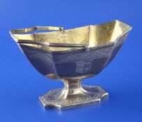 A George III silver Adam style pedestal sugar basket, with engraved armorials and reeded border