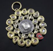 A 20th century Indian gold and silver, diamond and polychrome enamel pendant, of pierced circular