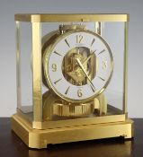 A Jaeger le Coultre brushed gilt metal Atmos clock, with arabic / baton numeral dial, numbered