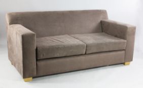A De La Espada two seat settee, upholstered in brown Alcantara, on tapering square section block