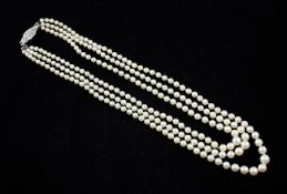 A 1920`s/1930`s triple strand graduated cultured pearl necklace with diamond set white gold clasp,