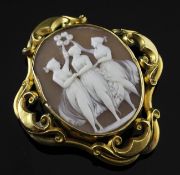 A Victorian gold mounted oval cameo brooch, with pierced scroll quatrefoil mount and carved with