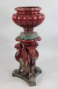 A Clement Massier flambe glazed jardiniere and stand, late 19th century, the lobed urn shaped