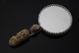 A Chinese silver and stone small hand mirror, the handle formed from an 18th / 19th century green