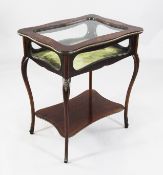 A mahogany floral marquetry inlaid bijouterie table, late 19th century, with glass top and sides,