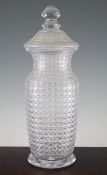 A hobnail cut glass vase and cover, late 19th century, of baluster form with starcut base and a