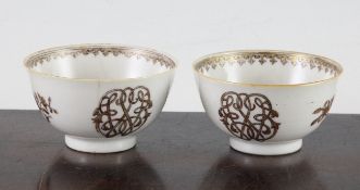 A pair of Chinese export rouge-de-fer and gilt decorated tea bowls, Qianlong period, each decorated