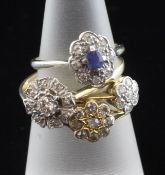 Three Edwardian 18ct gold and diamond cluster rings and a platinum, diamond and sapphire cluster