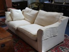 Two similar 20th century sofas, both upholstered in a cream fabric