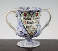 A Yorkshire pottery twin handled pedestal loving cup, dated 1839, transfer printed in blue with