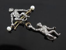 A late Victorian, gold and silver, diamond and pearl set bar brooch, modelled as a seated monkey