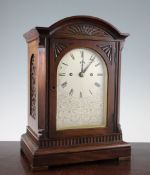 An Edwardian mahogany bracket clock, with silvered arched dial signed Thwaites & Reed,