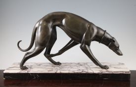 Attributed to Irenee Rochard (1906-1984). An Art Deco patinated metal hound, mounted on a white