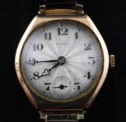 A 1930`s 9ct gold Rolex manual wind wrist watch, with shaped hexagonal case and Arabic dial with