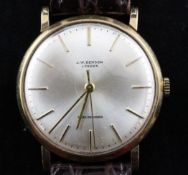 A gentleman`s 9ct gold manual wind wrist watch retailed by J.W. Benson, with baton numerals.