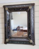 A Venetian cushion framed rectangular wall mirror, with floral etched glass mirror panels and