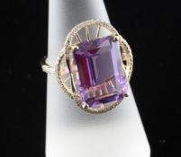 A 14ct gold, amethyst and diamond set dress ring, with emerald cut amethyst and diamond set cusped