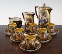 A Vienna style porcelain cabaret set, c.1910, each piece decorated with titled scenes of classical