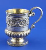 A George IV silver christening mug by Emes & Barnard, with fluted girdle, embossed foliate band with