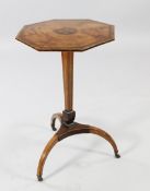 A Regency satinwood tripod table, the octagonal top with central flowerhead marquetry decoration, on