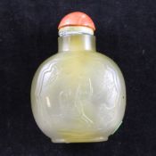 A Chinese chalcedony snuff bottle, 19th / 20th century, well hollowed and carved in relief with