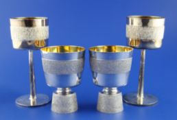 A pair of early 1970`s silver pedestal beakers by Roy Albert Flewin, with textured girdle and